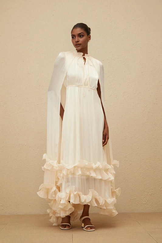 Cream Cape - Sleeve Maxi Dress with Ruffled Hem Intemporelle Neutral Cape Pleated Midi Dress Evening Dress by YiHuiw