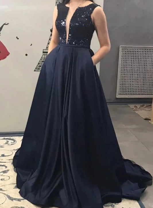 Deep blue sleeveless long dress with a deep V design and shiny sequins. The lower body is a large skirt suitable for dinners, award ceremonies by YiHuiw