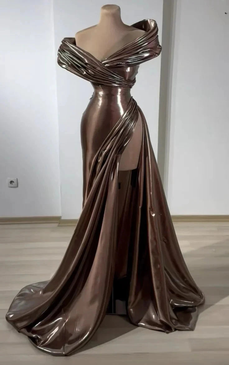 A brown dress with a metallic sheen, featuring an off shoulder deep V-design, paired with a high slit and a dangling tail by YiHuiw