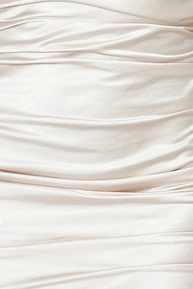 A light beige camisole short skirt with a thin camisole design full of folds, suitable for parties, dates, etc by YiHuiw