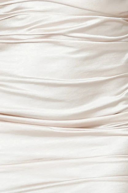 A light beige camisole short skirt with a thin camisole design full of folds, suitable for parties, dates, etc by YiHuiw