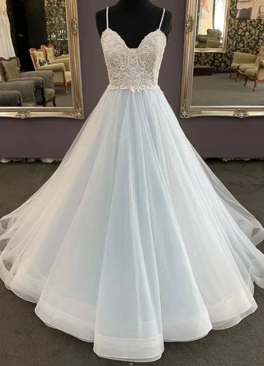 A light blue and white gradient wedding dress with deep V-neck straps and lace embroidery on the upper body, by YiHuiw