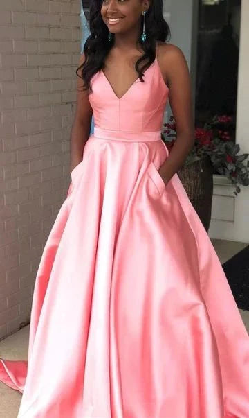 A light pink satin dress with a deep V-neck strap, high waist and large skirt, and pockets suitable for dinners, dances, and other occasions by YiHuiw