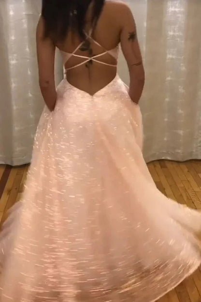 A light pink sequined dress with a deep V-neck strap and lace sequins suitable for dinners and parties by YiHuiw