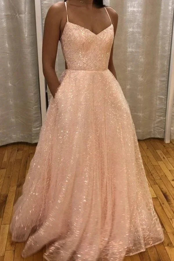 A light pink sequined dress with a deep V-neck strap and lace sequins suitable for dinners and parties by YiHuiw