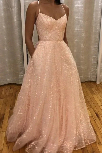 A light pink sequined dress with a deep V-neck strap and lace sequins suitable for dinners and parties by YiHuiw