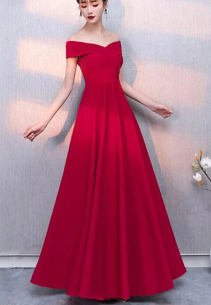A red formal dress with a one shoulder design and a waist cinching hem, suitable for dinner parties by YiHuiw