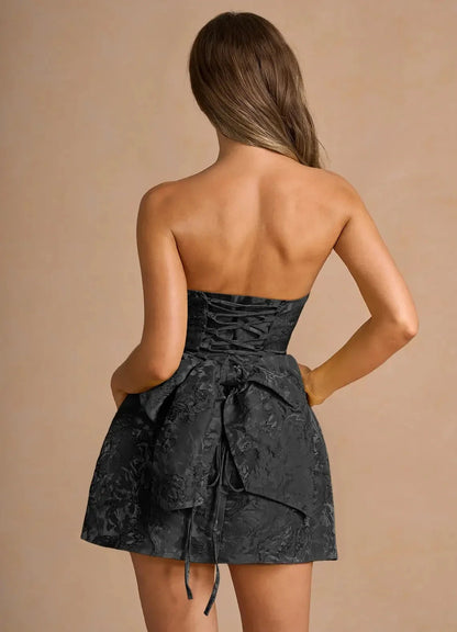 Black Strapless Jacquard Mini Dress with Lace - Up Back and Bow Detail Hadleigh Black Mini Dress Homecoming Dresses by YiHuiw