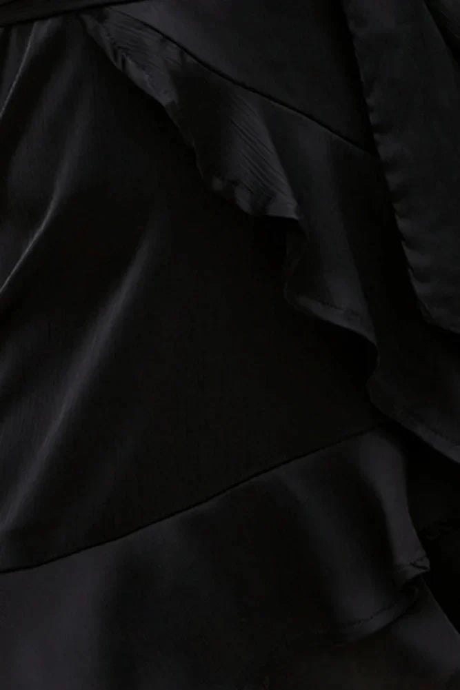 Black camisole short skirt with deep V-neck and thin camisole design. The skirt has multiple layers of ruffle edges, suitable for parties, dates, etc by YiHuiw