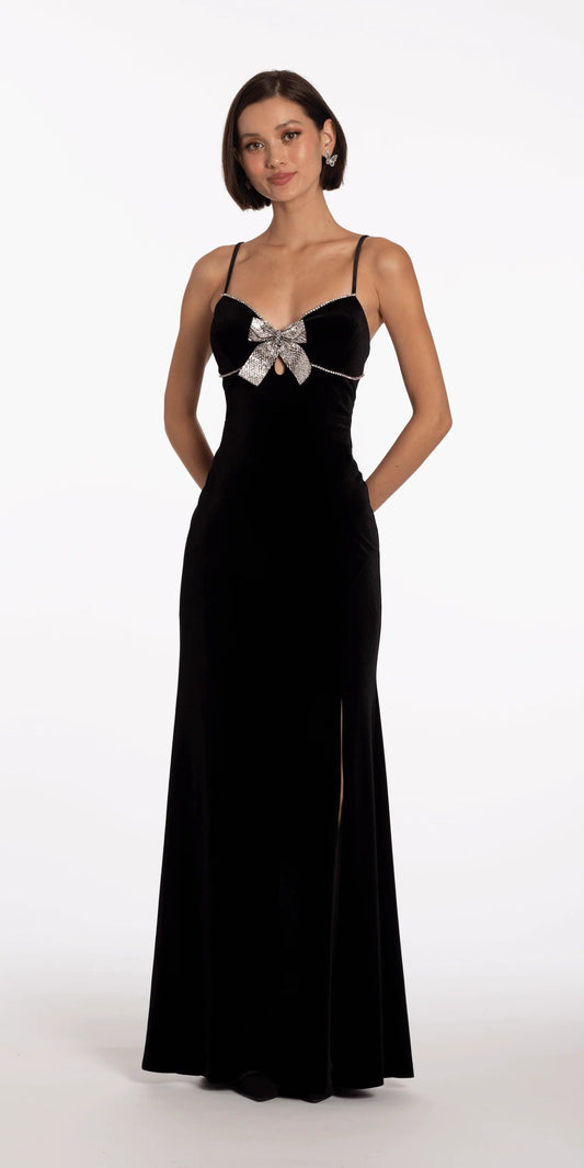 Black velvet evening dress with rhinestone bow, spaghetti straps, keyhole, and floor-length slit