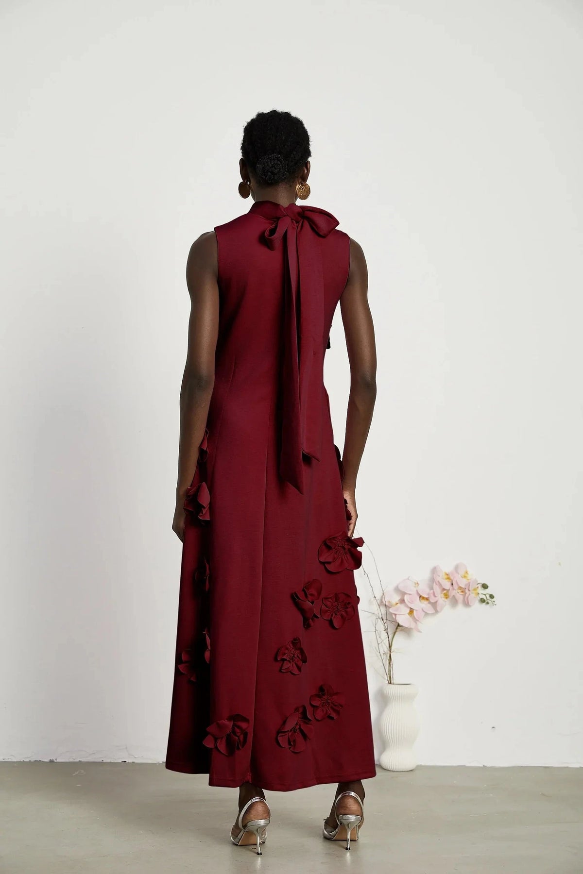 Burgundy Floral Applique Tie - Back Maxi Dress Red Sleeveless Maxi Dress with Faux Flower & Bow-Tie Embellishment Evening Dress by YiHuiw
