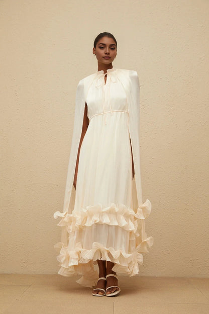Cream Cape - Sleeve Maxi Dress with Ruffled Hem Intemporelle Neutral Cape Pleated Midi Dress Evening Dress by YiHuiw