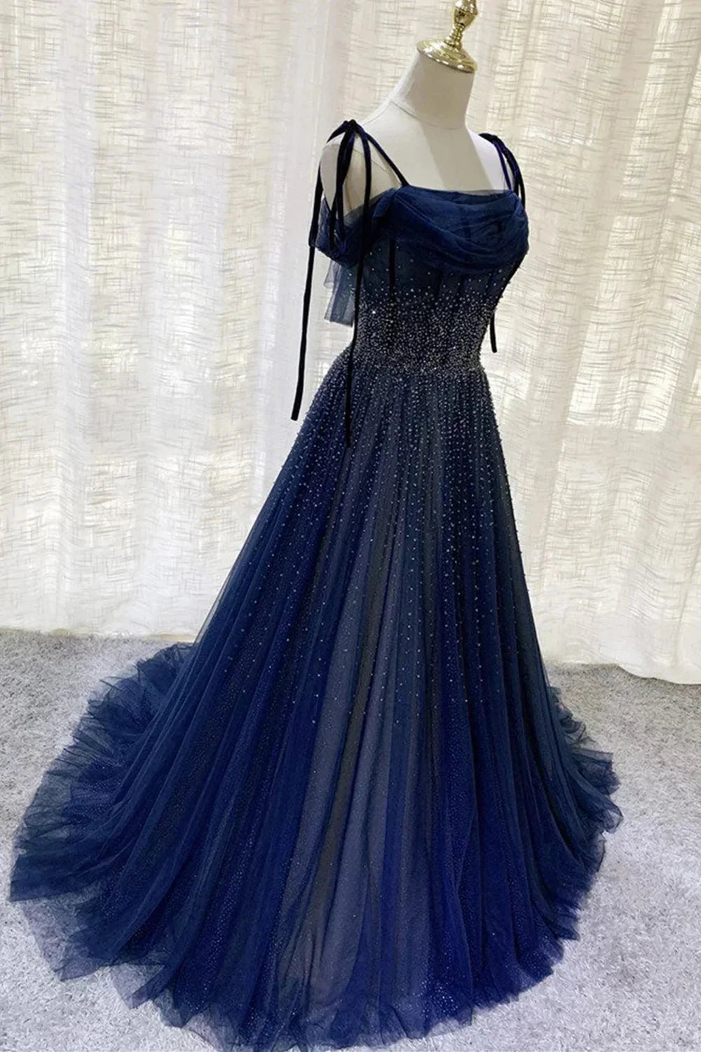 Deep blue mesh dress with suspender design and pleated nail beads embellishing the body by YiHuiw