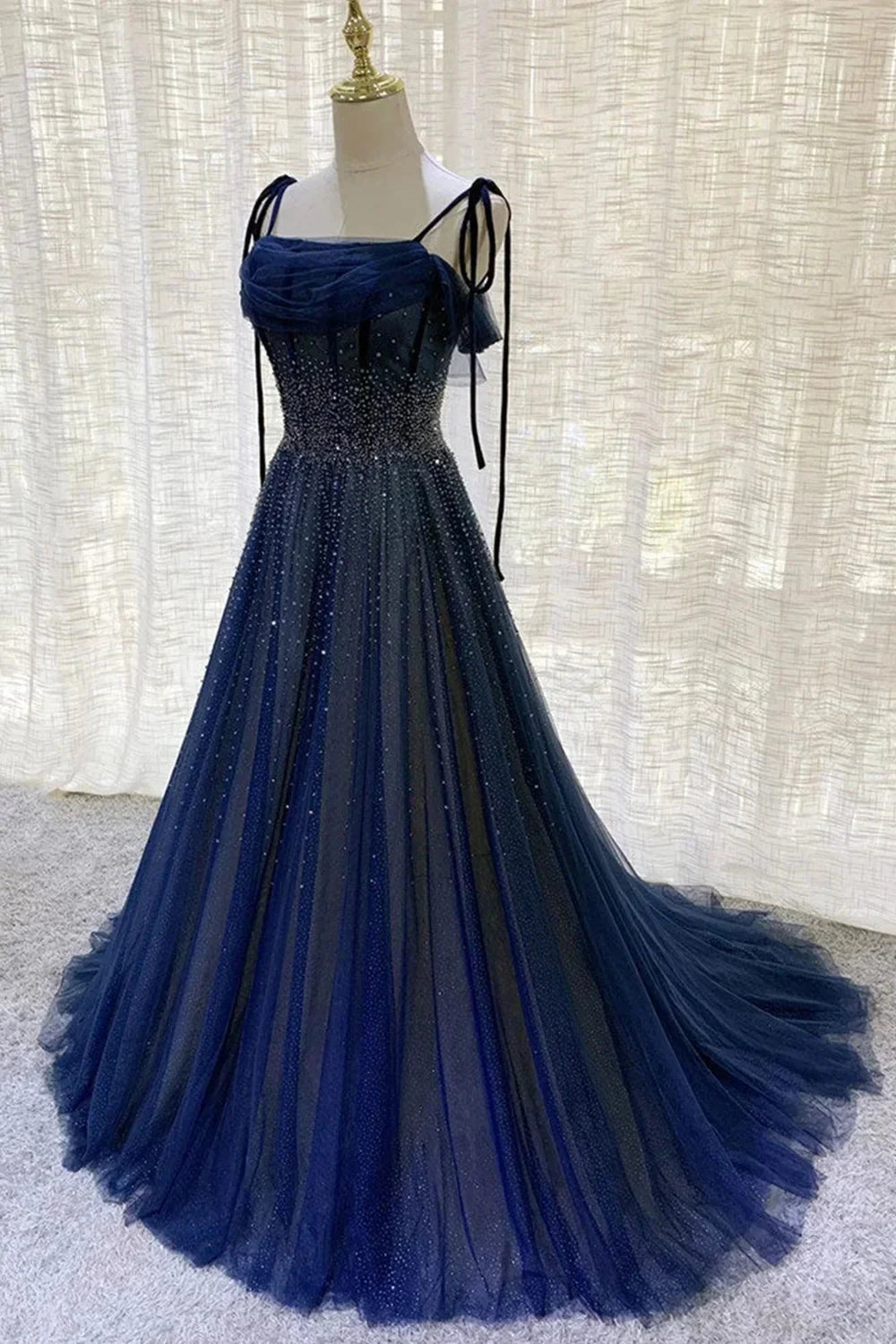 Deep blue mesh dress with suspender design and pleated nail beads embellishing the body by YiHuiw