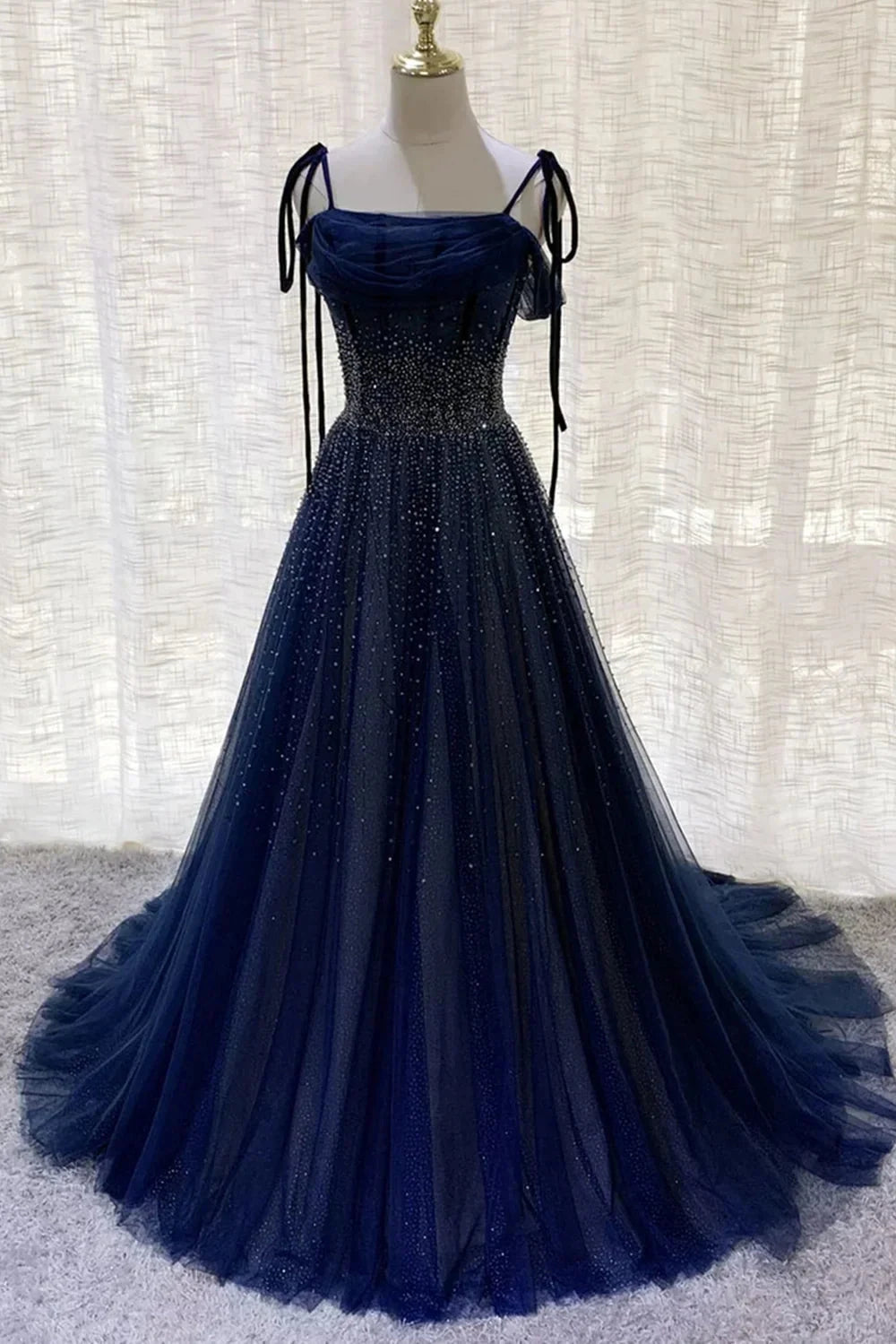 Deep blue mesh dress with suspender design and pleated nail beads embellishing the body by YiHuiw