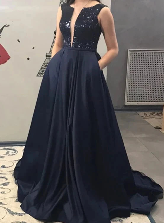 Deep blue sleeveless long dress with a deep V design and shiny sequins. The lower body is a large skirt suitable for dinners, award ceremonies by YiHuiw