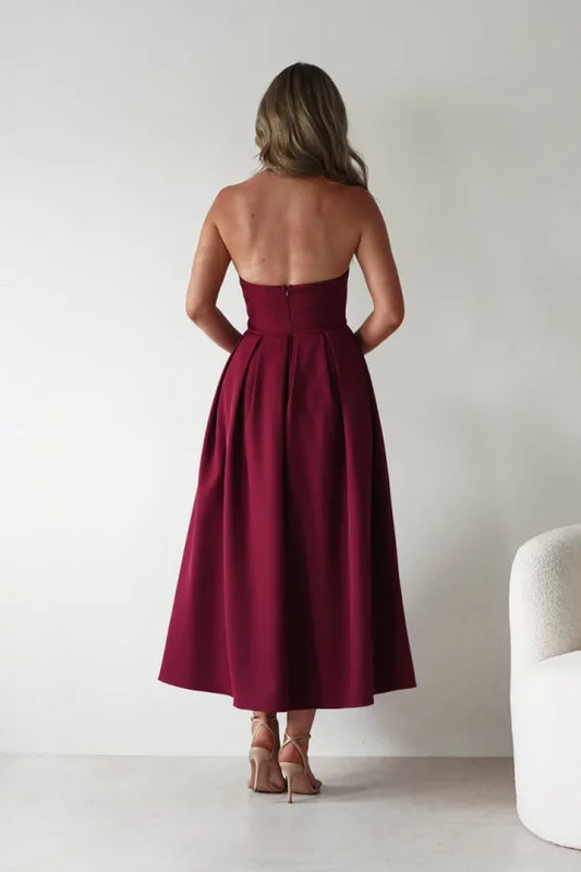Elegant structured crepe A-line halter open-back pleated midi evening dress