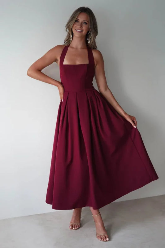 Elegant structured crepe A-line halter open-back pleated midi evening dress