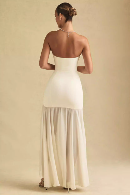 Encantador diseño de vestido de graduación de chifón de alta calidad sin tirantes, combinado con una falda asimétrica transparente y cortes tridimensionales