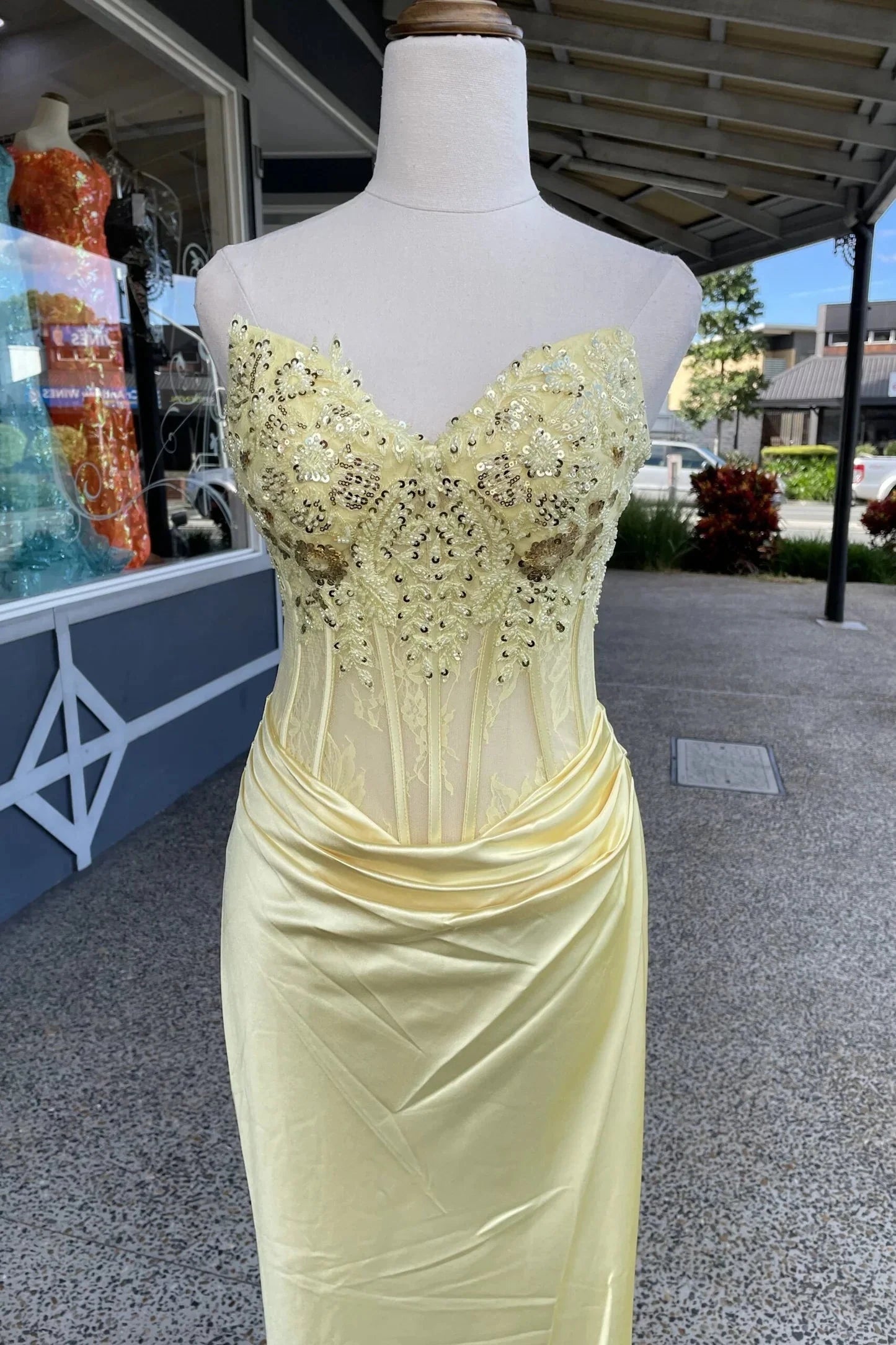 Golden yellow satin prom dress with strapless sweetheart neck, beaded lace corset, ruched waist, and mermaid skirt by JiMiss Dresses