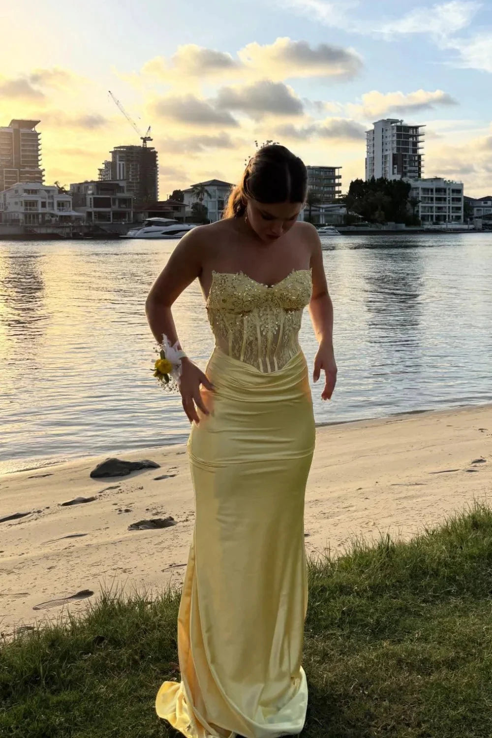 Golden yellow satin prom dress with strapless sweetheart neck, beaded lace corset, ruched waist, and mermaid skirt by JiMiss Dresses