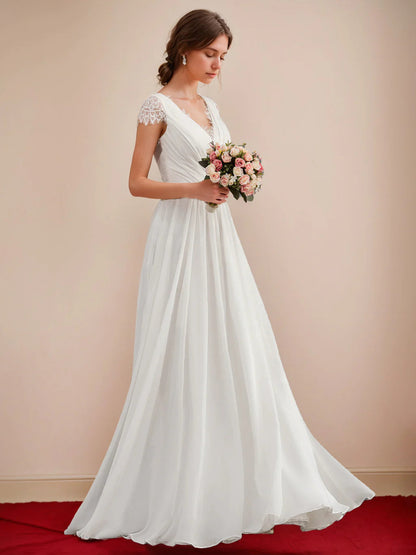 Vestido de novia de corte en A de gasa marfil con escote en V, corpiño fruncido, mangas cortas de encaje y espalda abierta de encaje