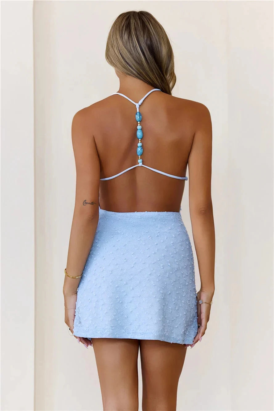 Light blue hanging neck dress, deep V-neck backless design, fabric with polka dot texture suitable for parties, vacations, etc by YiHuiw