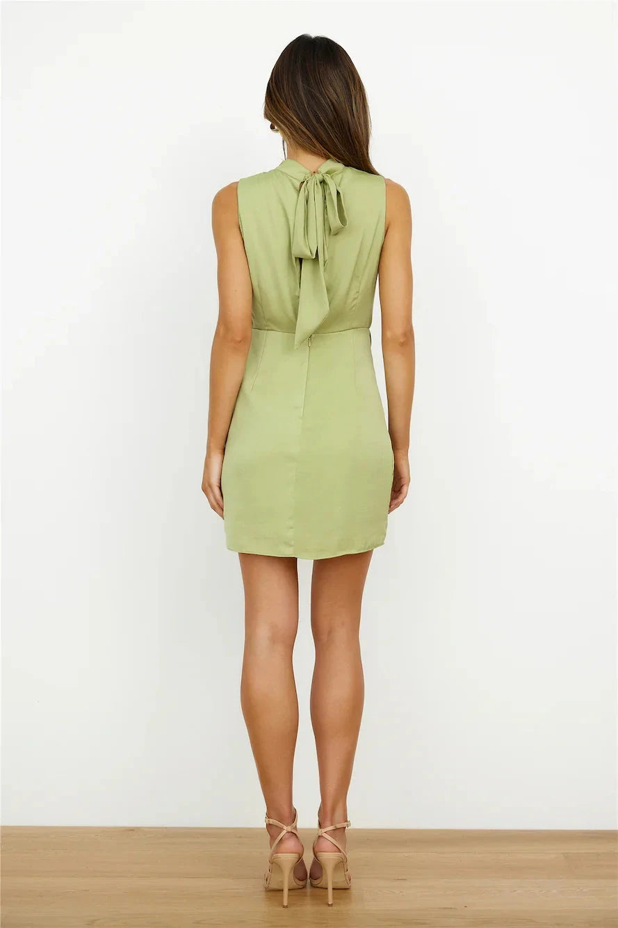 Light green sleeveless short dress with a hanging neckline and a pleated and irregular cut suitable for parties dates etc by YiHuiw