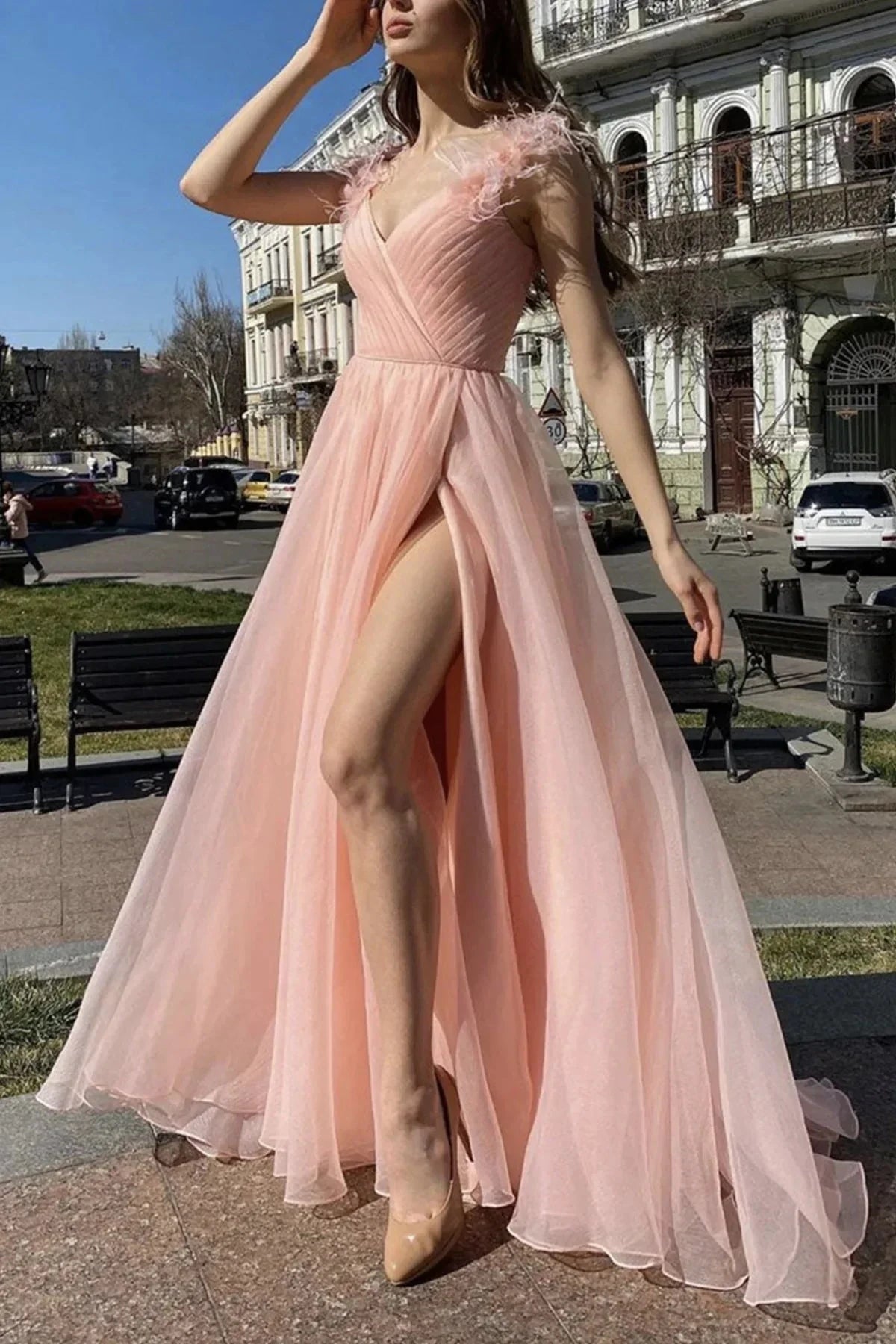 Light pink dress, deep V-neck, sleeveless design, with feather accents on the shoulders by YiHuiw