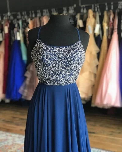 Long suspender dress with sequins or bead decorations on the upper body and a flowing deep blue skirt on the lower body, suitable for dinners, dances, etc by YiHuiw