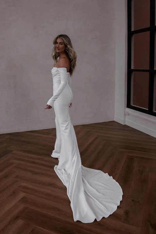 Off-the-Shoulder Long Sleeve Satin Mermaid Wedding Dress with Cathedral Train & Pearl Buttons by YiHuiw