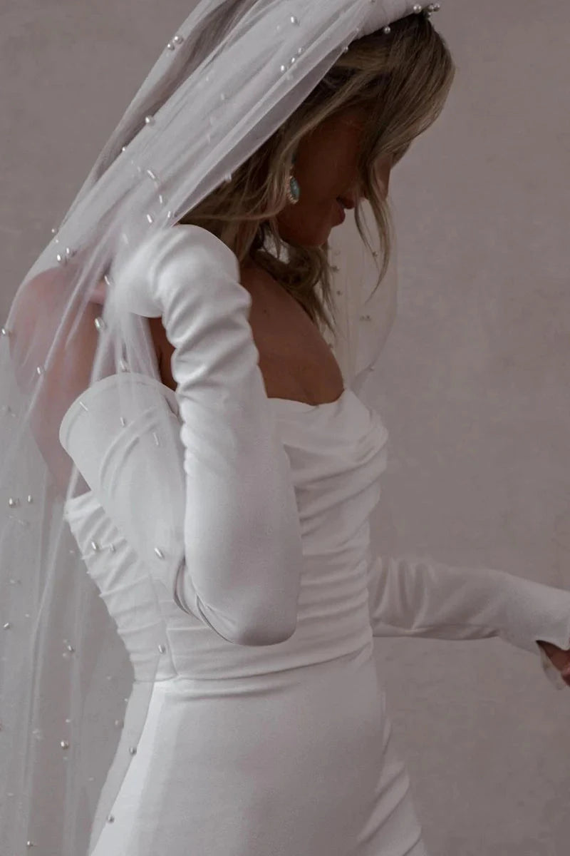 Off-the-Shoulder Long Sleeve Satin Mermaid Wedding Dress with Cathedral Train & Pearl Buttons by YiHuiw