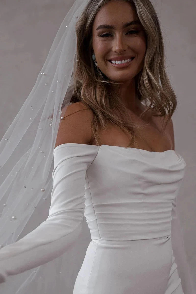 Off-the-Shoulder Long Sleeve Satin Mermaid Wedding Dress with Cathedral Train & Pearl Buttons by YiHuiw