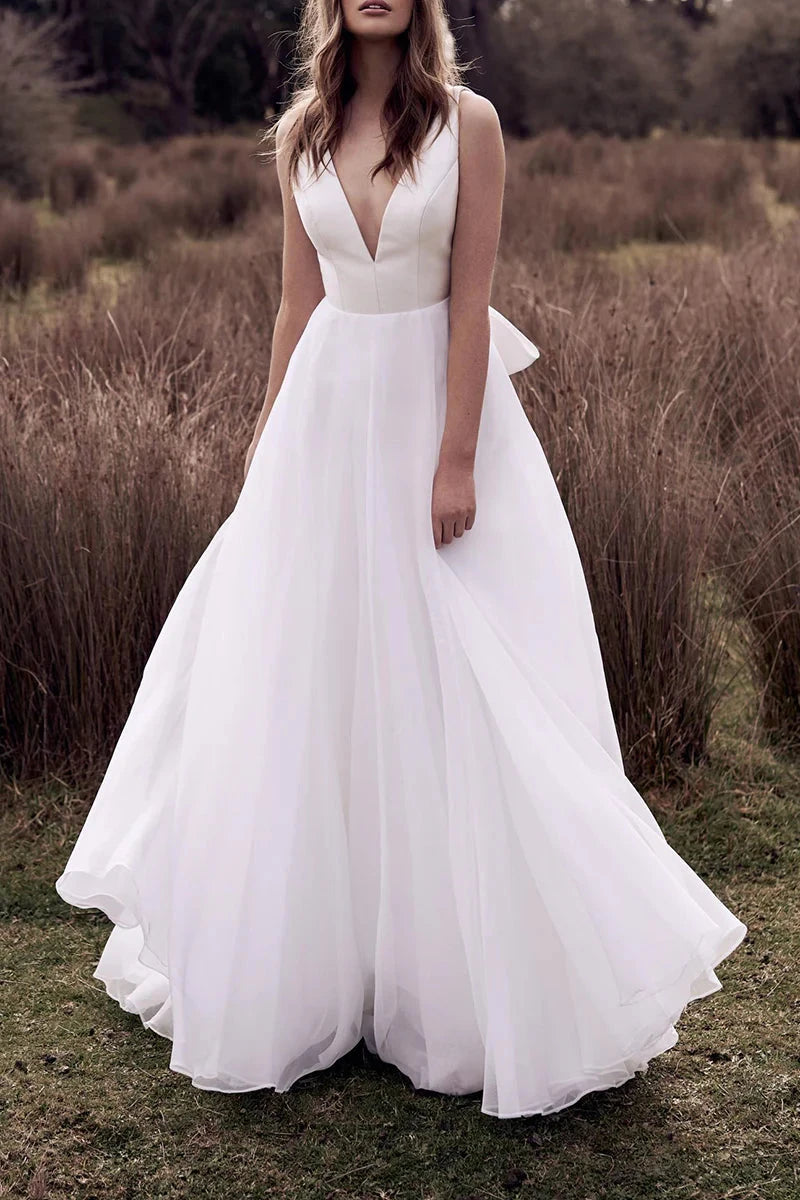 Romantic Chiffon A-Line Deep-V Open-Back Oversized-Bow Train Wedding Dress by YiHuiw