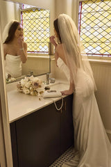 Sophisticated Fitted Mermaid Strapless Ruched Open Back Floor-Length Train Wedding Dress