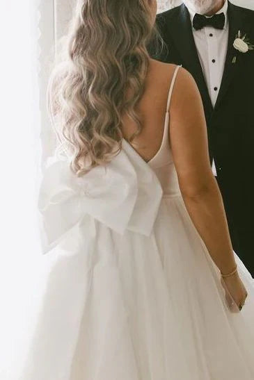 Spaghetti Strap Tulle Wedding Dresses with Deep V-Neck, Oversized Back Bow and Ruffled Tiered Skirt Bridal Dress