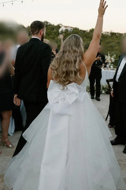 Spaghetti Strap Tulle Wedding Dresses with Deep V-Neck, Oversized Back Bow and Ruffled Tiered Skirt Bridal Dress