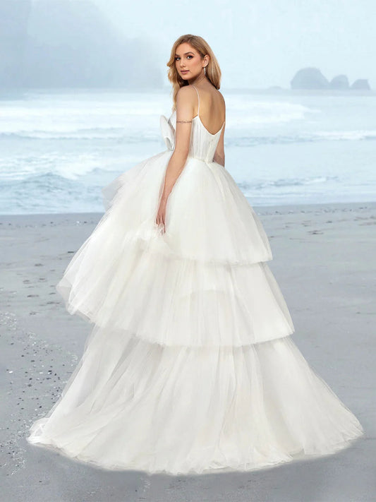 Spaghetti Strap V Neck Tulle Wedding Dress with Bow Decor Tiered Ruffle Sweep Train Bridal Dress
