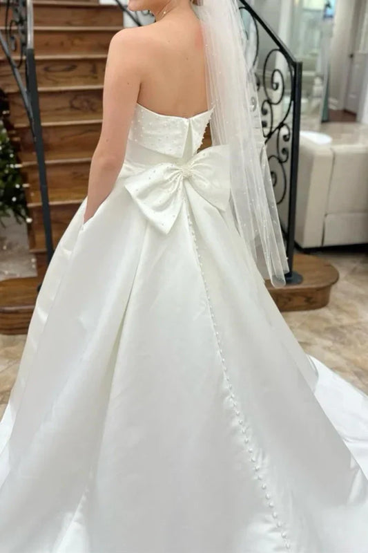 Strapless Satin Wedding Dresses with Pearl Embellishments, Oversized Back Bow, Side Pockets and Voluminous A-Line Skirt Bridal Dress