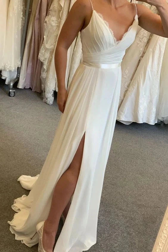 White camisole with deep V-neck and lace cross pleated design, high waisted split hem with trailing edge by YiHuiw