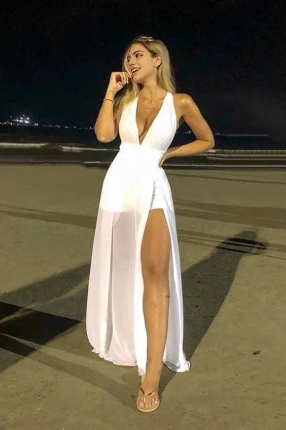 White deep V-neck camisole long dress with a deep V-neck and camisole design. The skirt has a high slit on the side, suitable for dinners, beach vacations, etc by YiHuiw