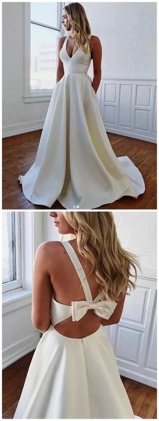 White deep V-neck sleeveless dress, with a deep V-neck cinched at the waist to highlight the figure, suitable for weddings, dinners, etc by YiHuiw