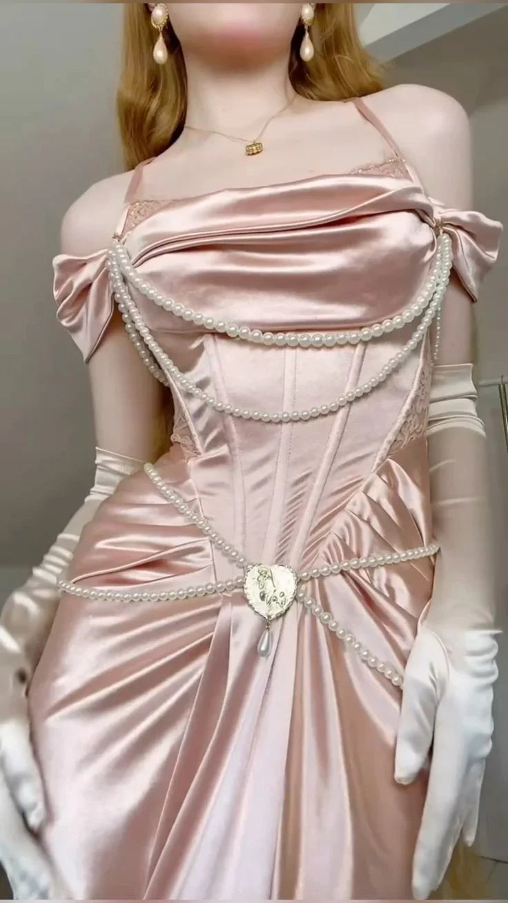 A light pink satin dress with an open shoulder strap design and a high slit skirt by YiHuiw